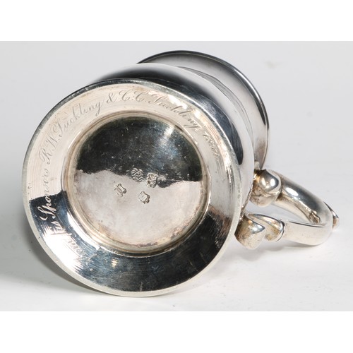 897 - A George II silver bell shaped mug, scroll-capped handle, skirted base, 12cm high, London 1748, 308g