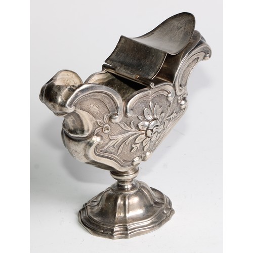 1072 - A South European silver pedestal liturgical incense boat, chased with flowers and C-scrolls, twin hi... 