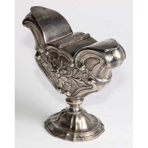 1072 - A South European silver pedestal liturgical incense boat, chased with flowers and C-scrolls, twin hi... 