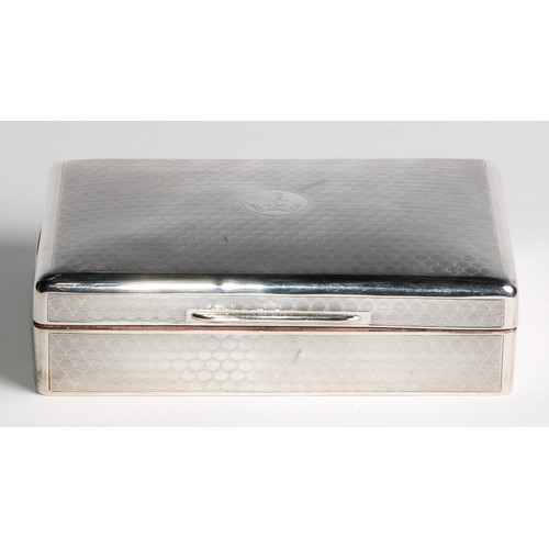 973 - A George V silver rounded rectangular cigar box, of military interest, engine turned overall, the hi... 