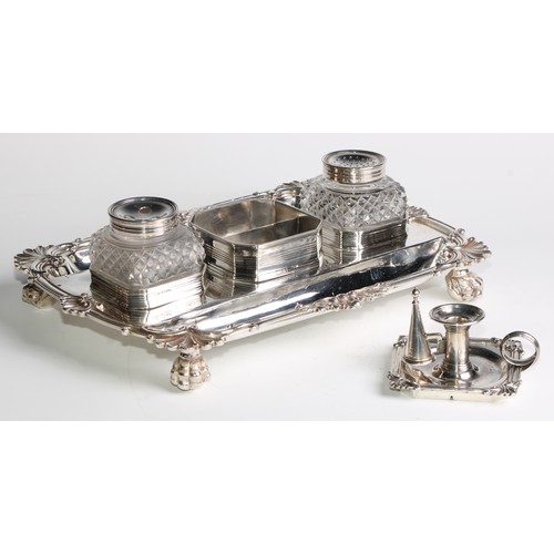 938 - A George III silver shaped rectangular partners' inkstand, central wafer box enclosed by a taperstic... 