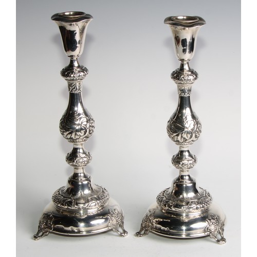 1216 - Judaica - a pair of Russian Empire silver Jewish Sabbath candlesticks, knopped pillars, domed circul... 