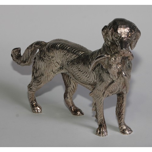 830 - A silver plated table decoration, cast as a gun dog holding a pheasant, 22cm long