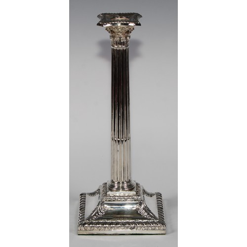 823 - A pair of George III Old Sheffield Plate stop-fluted Corinthian column candlesticks, beaded nozzles,... 