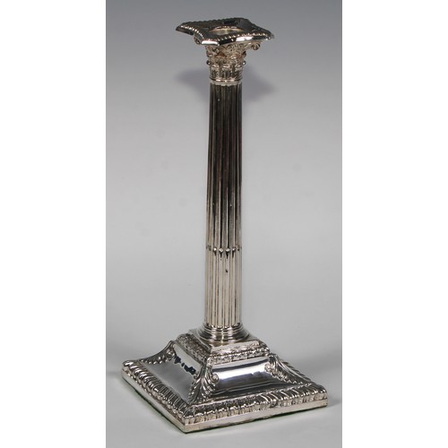 823 - A pair of George III Old Sheffield Plate stop-fluted Corinthian column candlesticks, beaded nozzles,... 