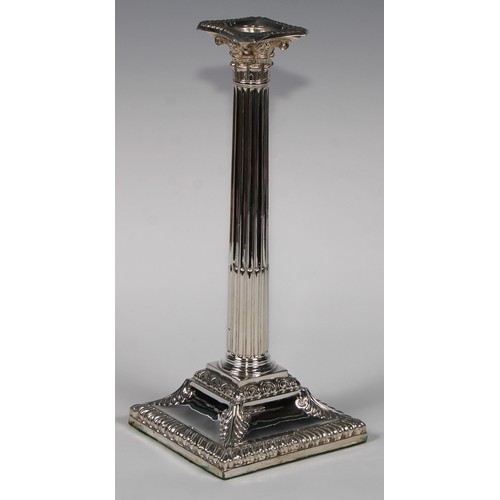 823 - A pair of George III Old Sheffield Plate stop-fluted Corinthian column candlesticks, beaded nozzles,... 