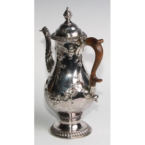 806 - A George III Old Sheffield Plate baluster coffee pot, chased with flowering leafy swags, hinged ogee... 