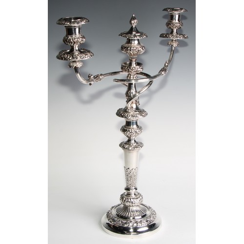 827 - A post-Regency Old Sheffield Plate four-piece table lighting suite, comprising a pair of three-light... 