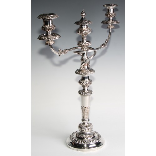 827 - A post-Regency Old Sheffield Plate four-piece table lighting suite, comprising a pair of three-light... 