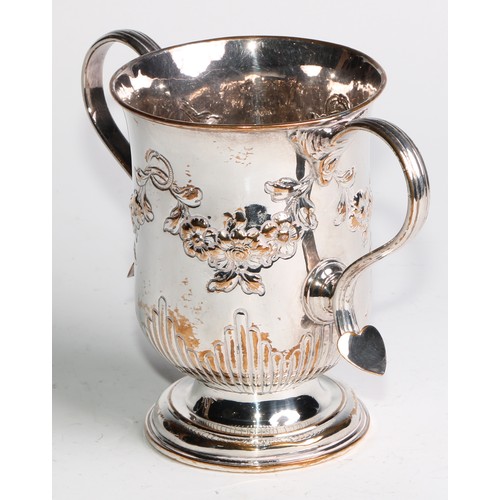 807 - A George III Old Sheffield Plate bell shaped loving cup, half-fluted and chased with flowering swags... 