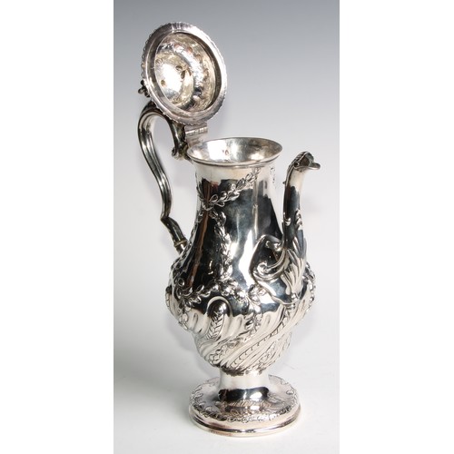 1148 - An early George III silver baluster coffee pot, wrythen half-fluted and chased with leafy branches, ... 