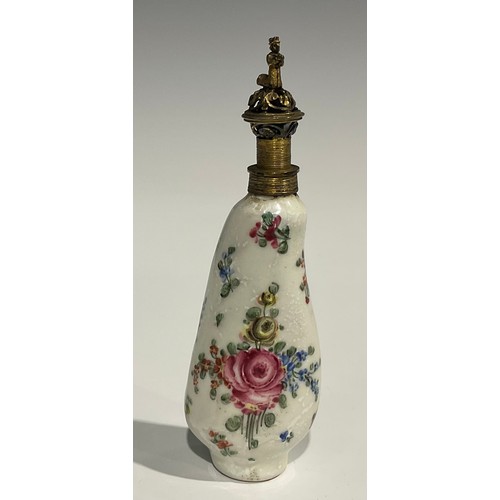 2271 - An 18th century Continental porcelain scent bottle, painted with flowers, reticulated gilt metal cov... 