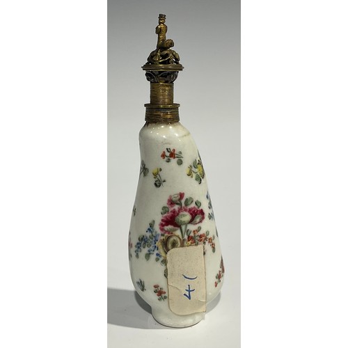 2271 - An 18th century Continental porcelain scent bottle, painted with flowers, reticulated gilt metal cov... 