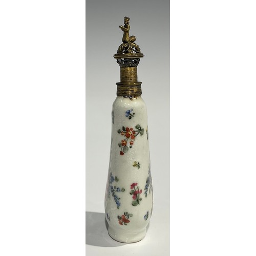 2271 - An 18th century Continental porcelain scent bottle, painted with flowers, reticulated gilt metal cov... 