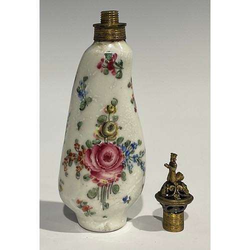 2271 - An 18th century Continental porcelain scent bottle, painted with flowers, reticulated gilt metal cov... 