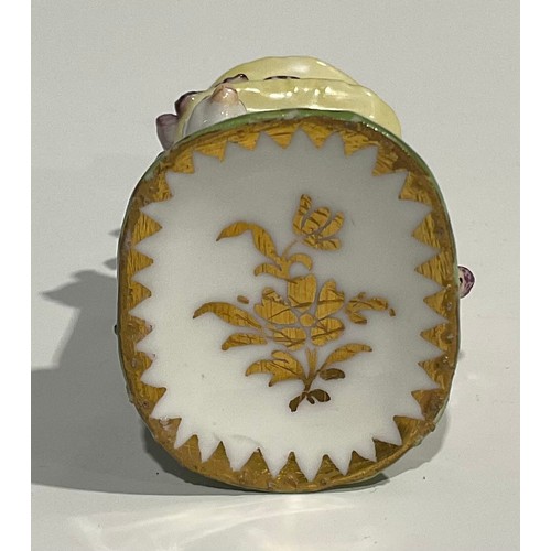 2271 - An 18th century Continental porcelain scent bottle, painted with flowers, reticulated gilt metal cov... 