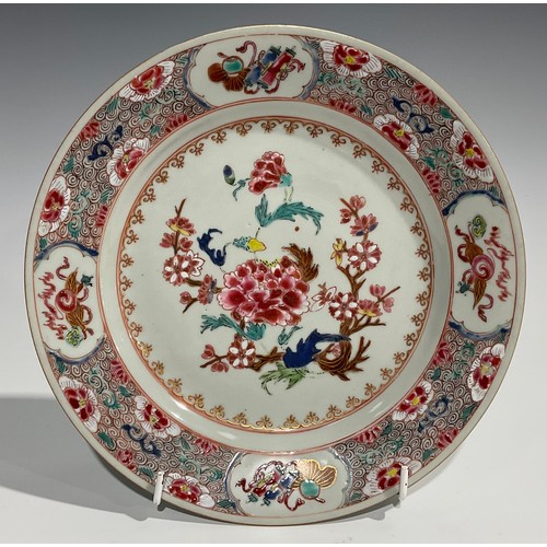 362 - A Chinese circular plate, decorated in polychrome enamels with chrysanthemums and blossoming prunus,... 