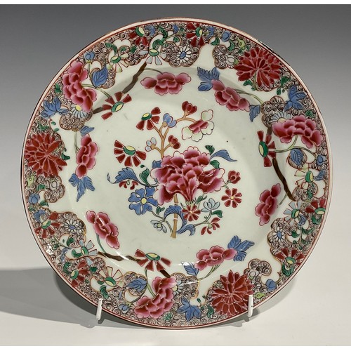 362 - A Chinese circular plate, decorated in polychrome enamels with chrysanthemums and blossoming prunus,... 