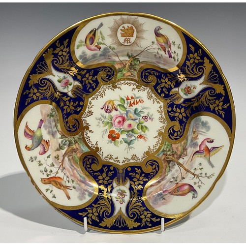 288 - A Continental porcelain plate, probably Sevres, the field painted with flowers in gilt c-scroll cart... 