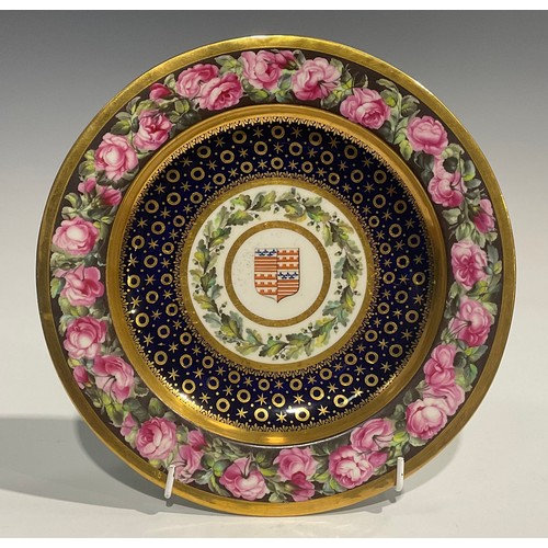 231 - A Derby Armorial circular plate, probably by William Billingsley, the field painted with the arms of... 