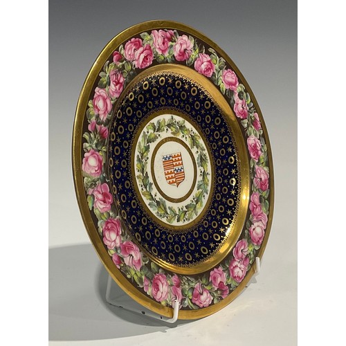 231 - A Derby Armorial circular plate, probably by William Billingsley, the field painted with the arms of... 