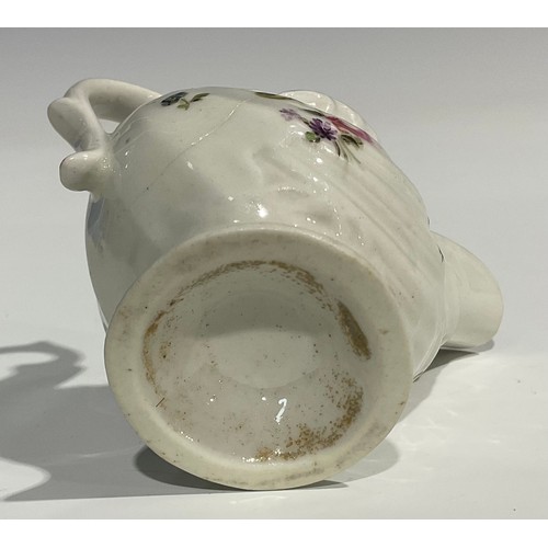 235 - A Derby dolphin ewer cream jug, in relief with shell moulding, painted in polychrome with flowers an... 