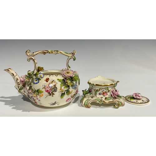 167 - A Coalbrookdale teapot and stand, painted with flowers and insects and profusely encrusted with flow... 