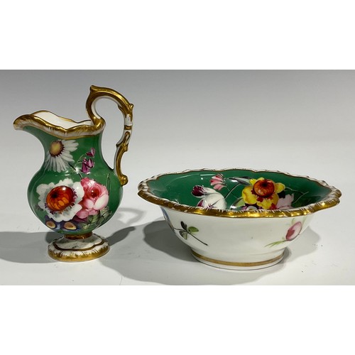 158 - An English porcelain miniature jug and bowl, probably Rockingham, painted with flowers on a green gr... 