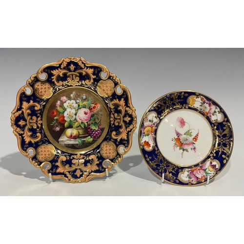 162 - An English porcelain shaped circular plate, the field painted with a basket of flowers and fruit on ... 