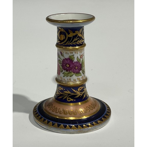 116 - A Charles Bourne miniature candlestick, the column painted with flowers, cobalt blue borders, applie... 