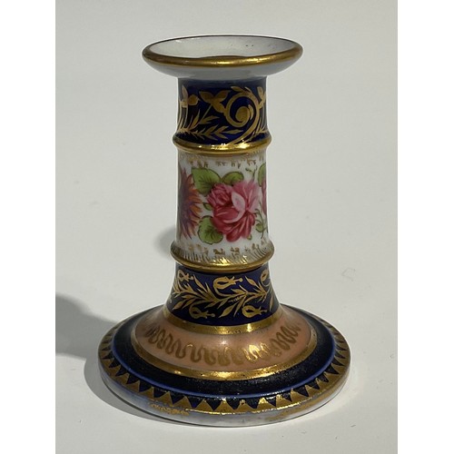 116 - A Charles Bourne miniature candlestick, the column painted with flowers, cobalt blue borders, applie... 