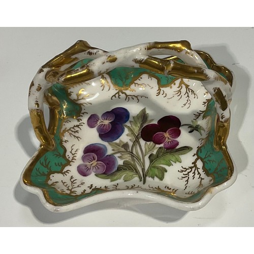 140 - A Rockingham pot pourri basket, with overhanging rim, painted with flowers, naturalistically moulded... 