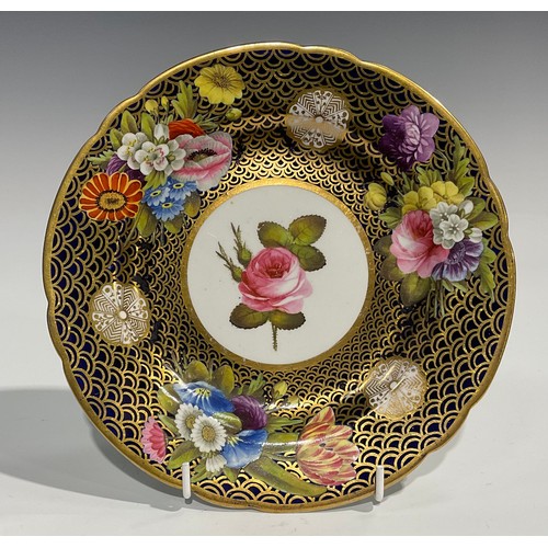 148 - A Spode circular plate, with circular cartouche painted with a pink rose, within a border painted wi... 