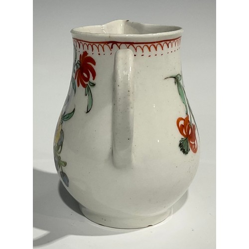 223 - A Worcester sparrow beak jug, decorated in polychrome, with stylised flowers and foliage, crows foot... 