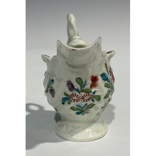 205 - A Worcester dolphin ewer cream jug, in relief with shell moulding, painted in polychrome with flower... 