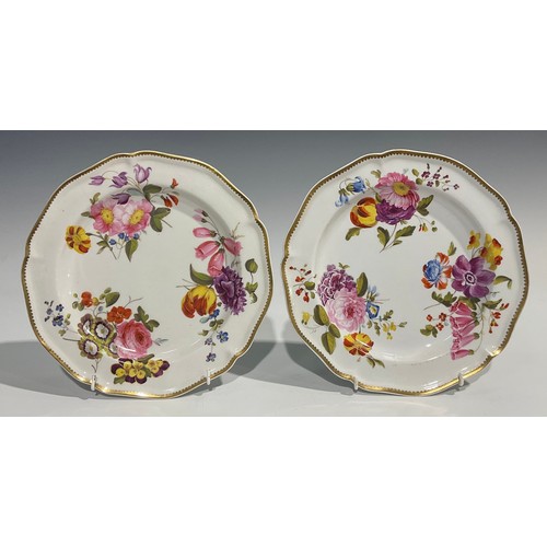 249 - A pair of Derby shaped circular plates, painted with summer flowers, gilt rim, in the manner of Will... 