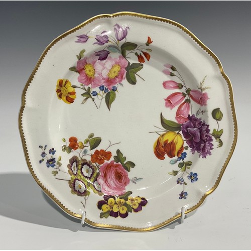 249 - A pair of Derby shaped circular plates, painted with summer flowers, gilt rim, in the manner of Will... 