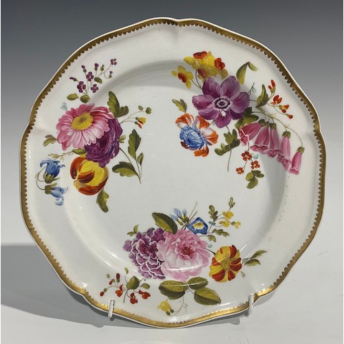 249 - A pair of Derby shaped circular plates, painted with summer flowers, gilt rim, in the manner of Will... 