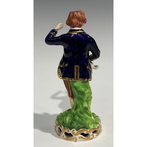 246 - A pair of Derby figures, of a boy and girl, he stands wearing a blue jacket and striped breeches hol... 