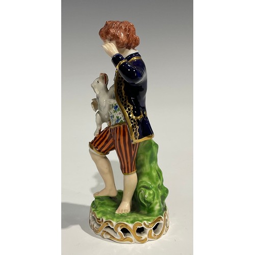 246 - A pair of Derby figures, of a boy and girl, he stands wearing a blue jacket and striped breeches hol... 