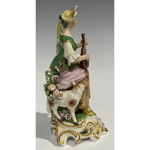 250 - A pair of Derby type figures, of musicians, both in fanciful dress, she with lute, a sheep at her fe... 