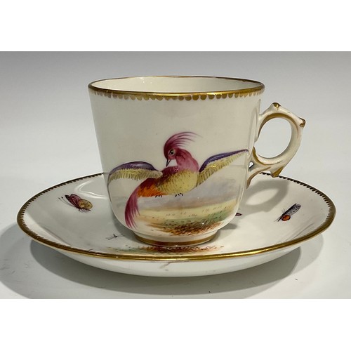 211 - A Worcester fluted teacup and saucer, circular cartouches painted with lakeside scenes, edged with a... 