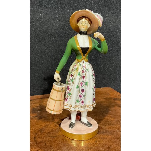 177 - A Chamberlains Worcester figure, of a milkmaid, she stands wearing a bonnet, green bodice and floral... 