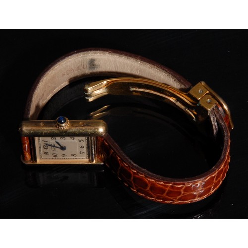 1284 - A Cartier ladies 'tank' watch, rectangular silvered dial, Arabic numerals, 'riveted' gold plated sil... 