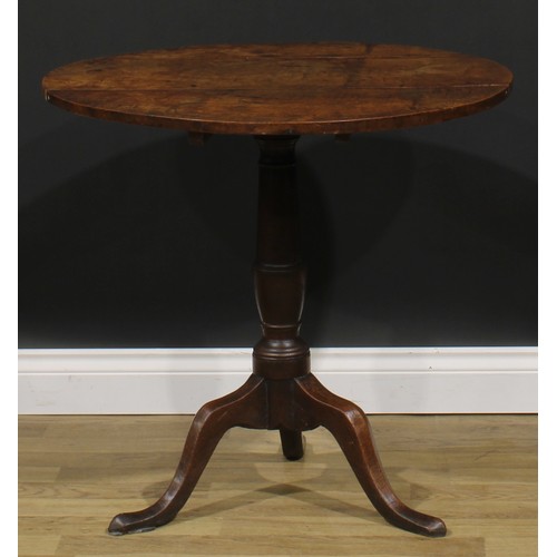 2122 - A George III oak tripod occasional table, circular tilting top, turned column, cabriole legs, pointe... 