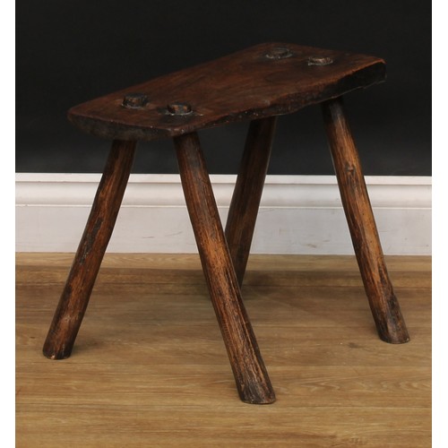 2053 - A late 18th/early 19th century elm cutler’s or craftsman’s stool, softwood legs, 48cm high, the top ... 