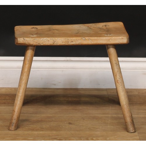 2053 - A late 18th/early 19th century elm cutler’s or craftsman’s stool, softwood legs, 48cm high, the top ... 