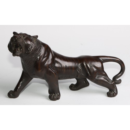 415 - Japanese School (Meiji period), a brown patinated bronze, of a tiger, 27cm long