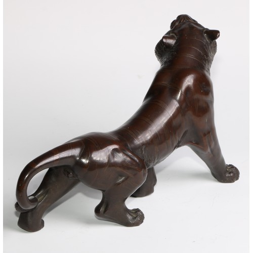 415 - Japanese School (Meiji period), a brown patinated bronze, of a tiger, 27cm long