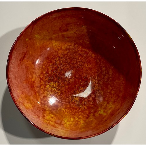 105 - A Moorcroft circular pedestal bowl, glazed in mottled iron red and yellow tones, 25cm diameter, impr... 